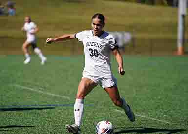 Female student athlete playing soccer