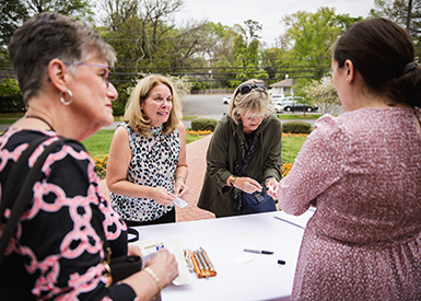 Alumni talking around a table