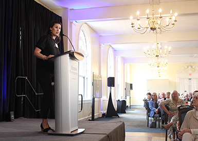 Ariel Lawhon standing at podium