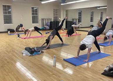 People doing yoga in yoga class