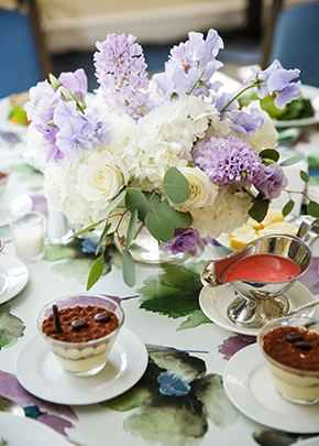 Dessert with flowers on table