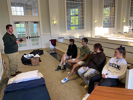 Students listening to instructions in chapel