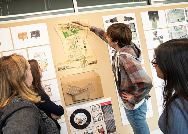 IAD students discussing drawings